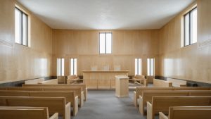 Läsvärt 3 Editorial photograph of an empty modern Nordic courtroom interior pale birch wo